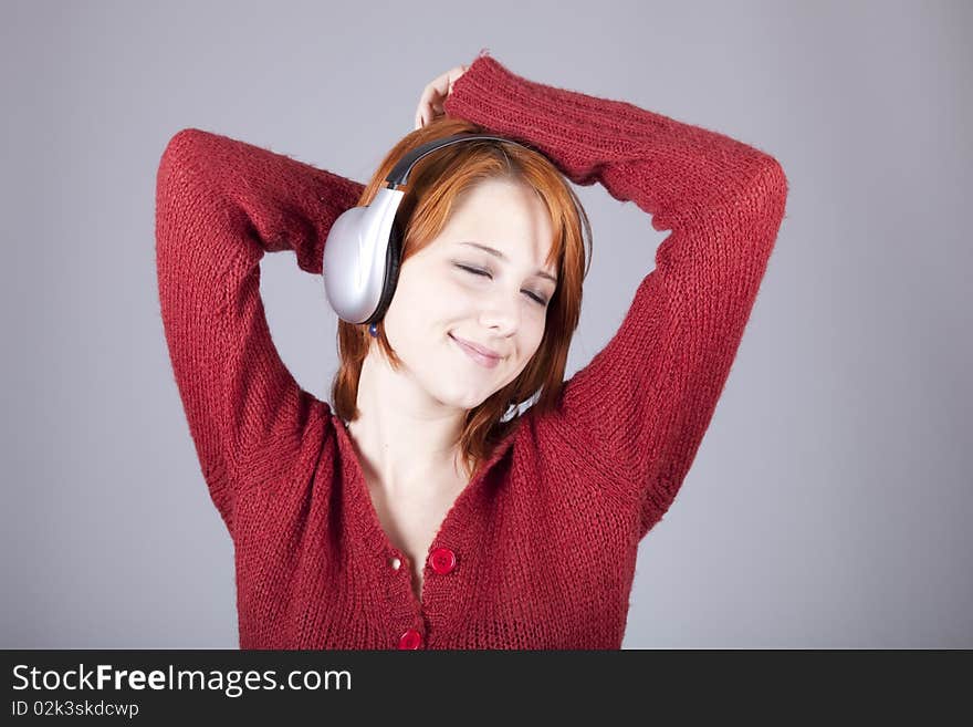 Girl with modern headphones. Studio shot.