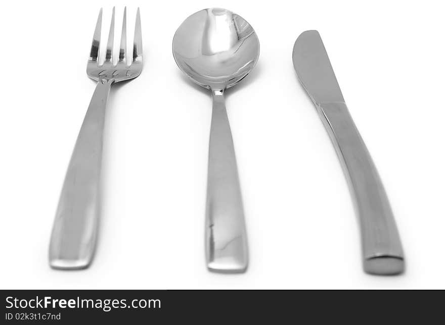 The Silver plug and spoon isolated on grey background. The Silver plug and spoon isolated on grey background