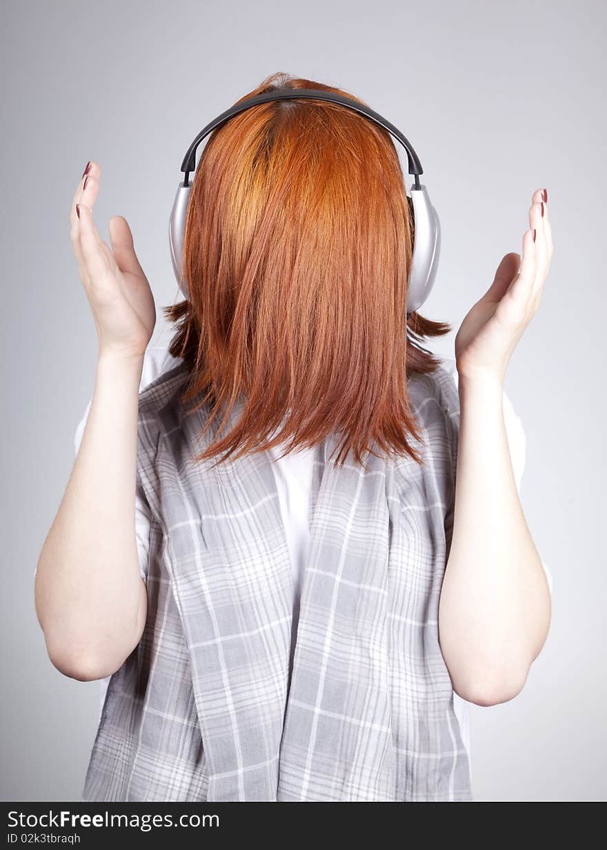 Unusual red-haired girl with headphones