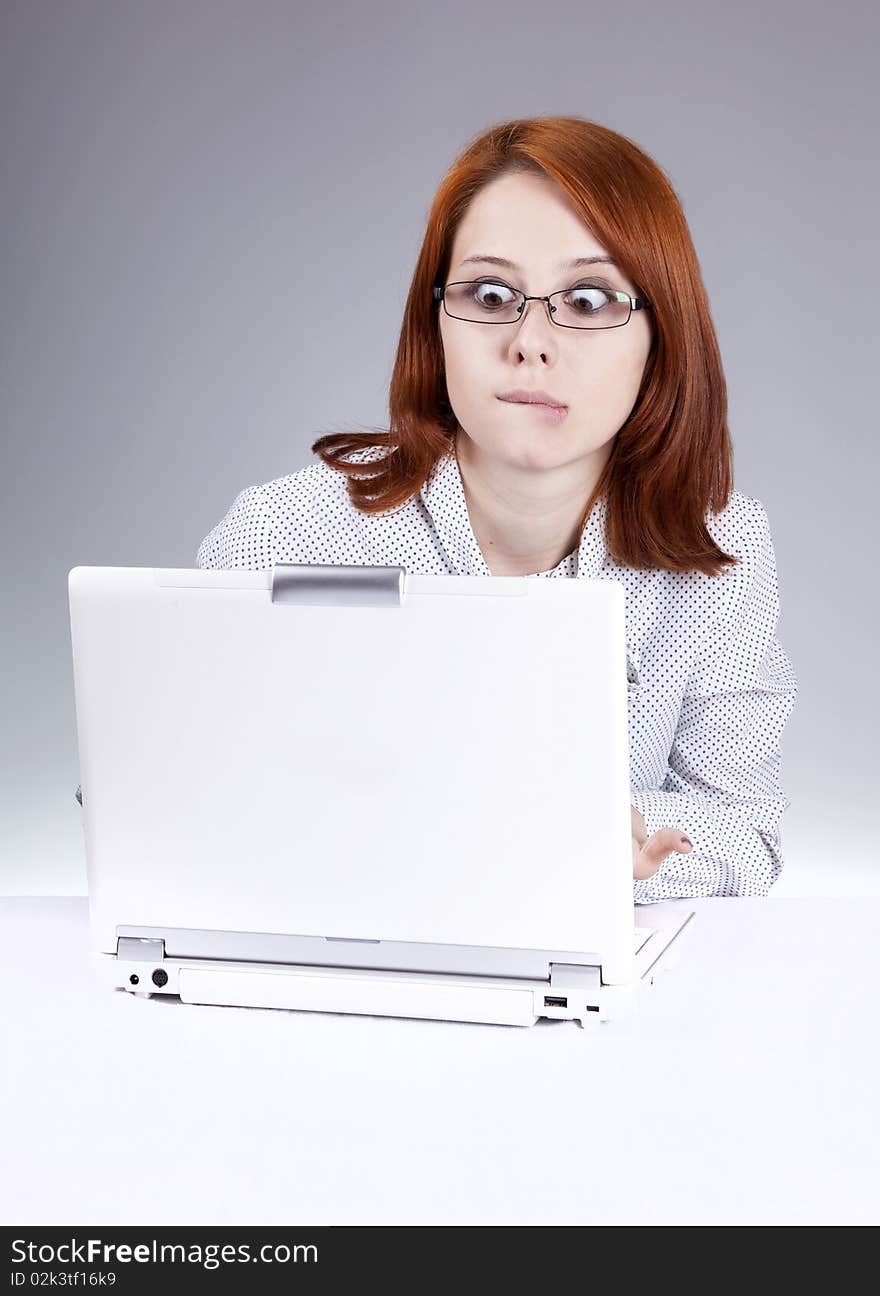 Red-haired girl with white notebook