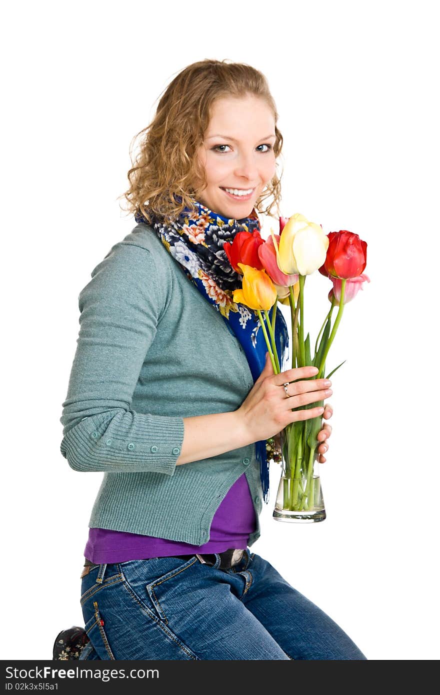 Caucasian young girl with tulips on isolated background