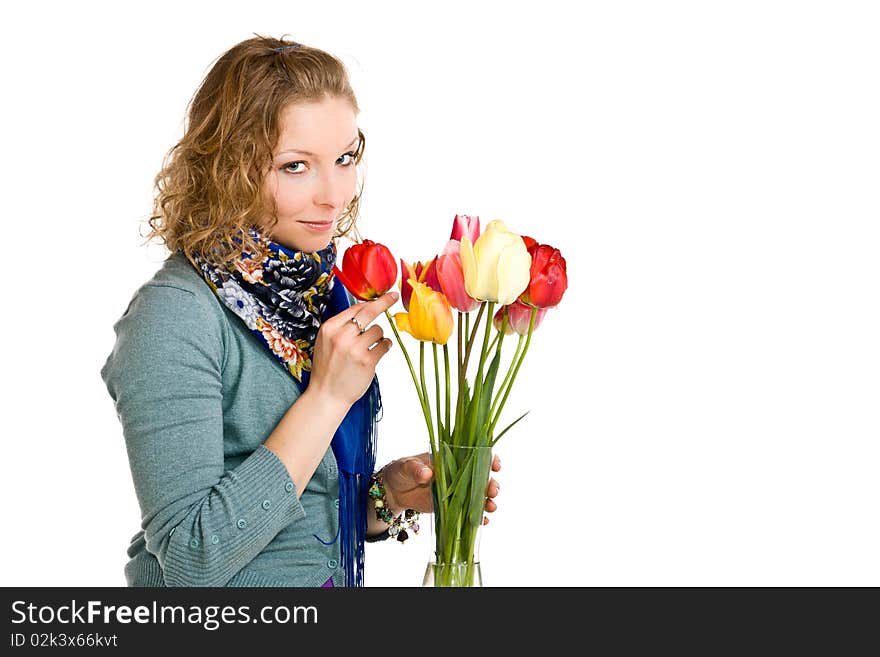 Caucasian young girl with tulips on isolated background