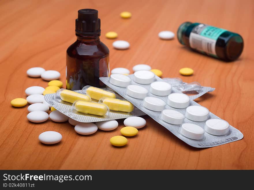 Heap of pills and medicine on a table