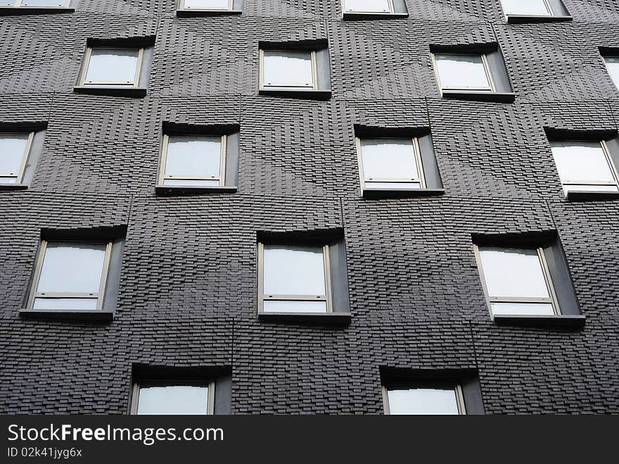 Modern brick apartment building windows. Modern brick apartment building windows.