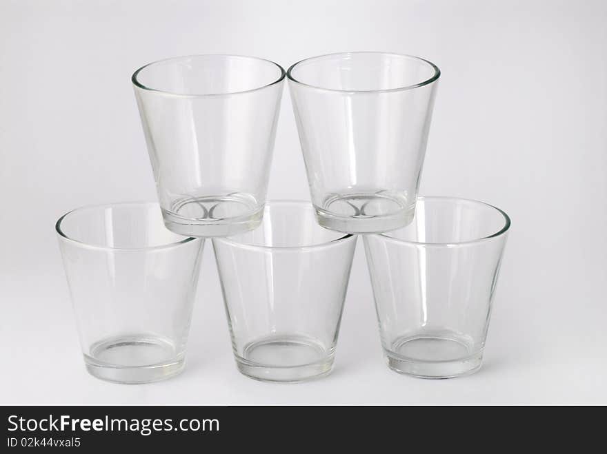 Five glasses with cherries inside