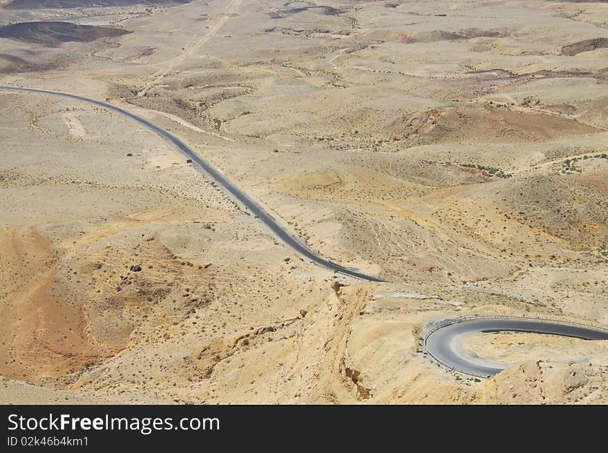 View on dry desert with yellow sand and rocks in Israel