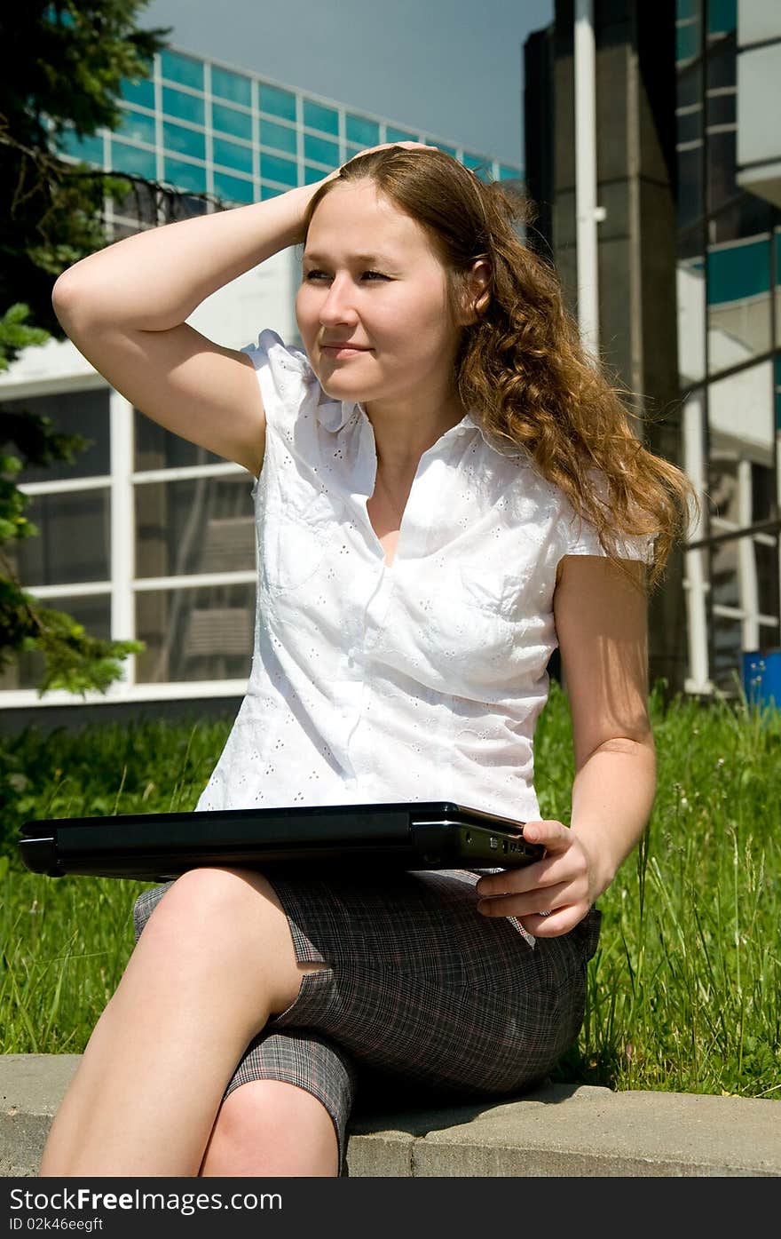 Adirable woman with laptop outdoor. Adirable woman with laptop outdoor