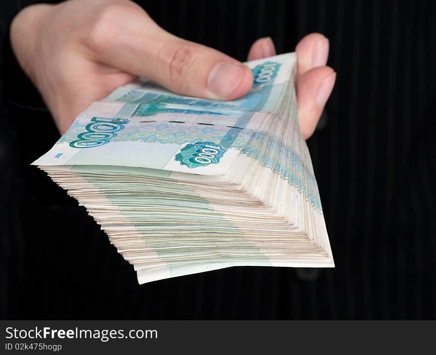 Hand holding boundle of roubles. Hand holding boundle of roubles