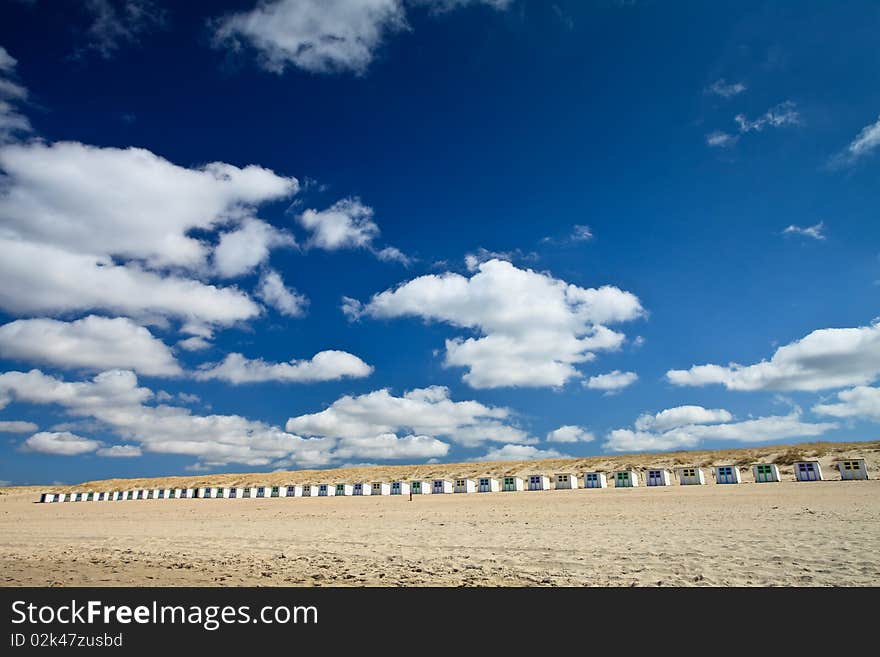 Small rental cabin on the beach with clouds in the blue sky