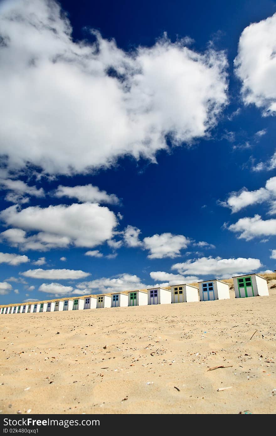 Small rental cabin on the beach with clouds in the blue sky