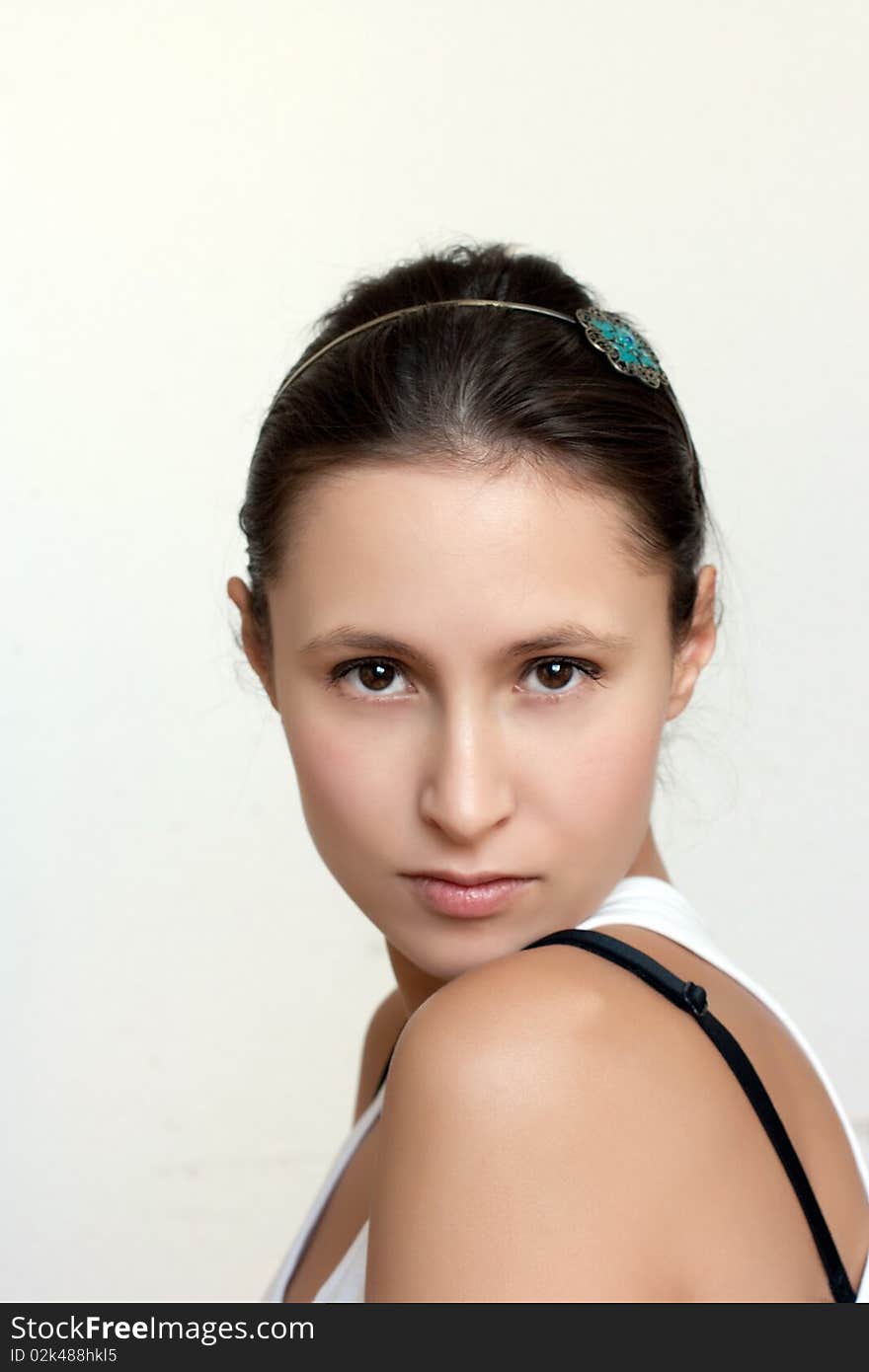 Young female with natural make up on light background. Young female with natural make up on light background