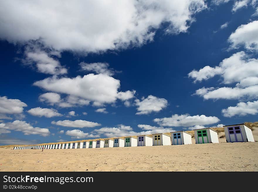 Small rental cabin on the beach with clouds in the blue sky