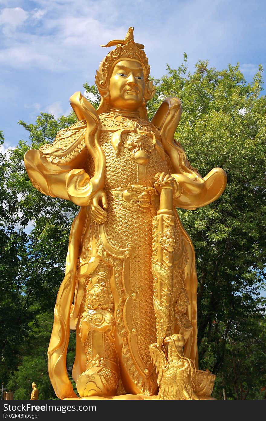 Chinese warrior golden statue in Thai temple