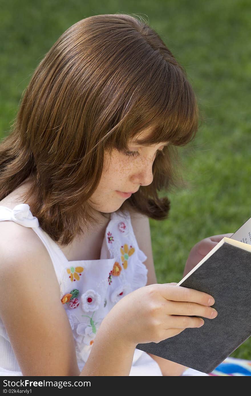 Young Beautiful Girl Reading