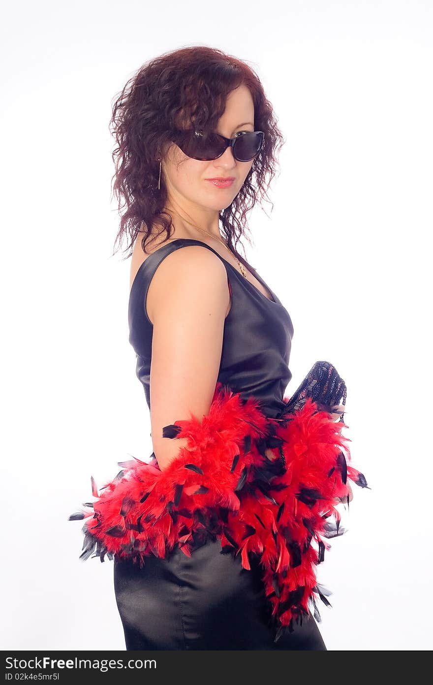 Classical lady wearing black sunglasess and red feathers