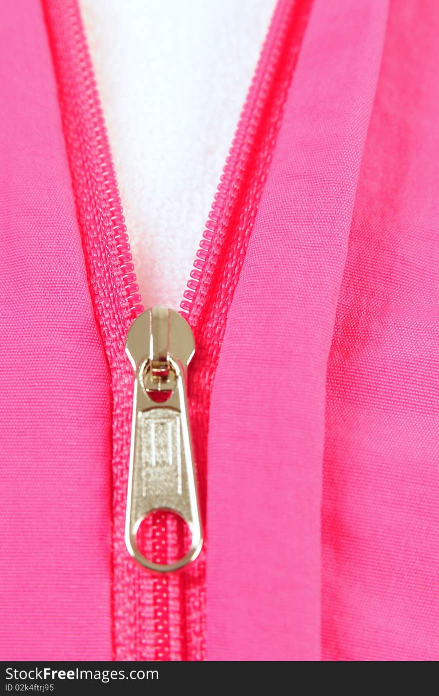 Close up of an open zipper over white background. Selective focus. Close up of an open zipper over white background. Selective focus.