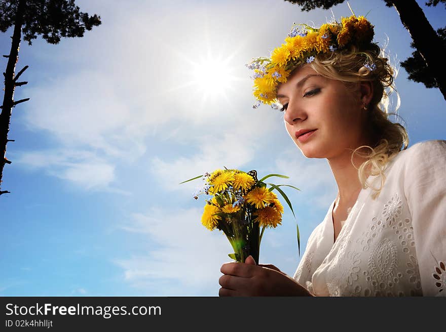 Woman with dandelion flowers