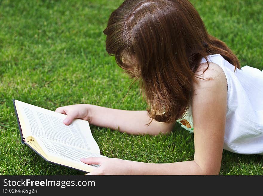 Young beautiful girl reading