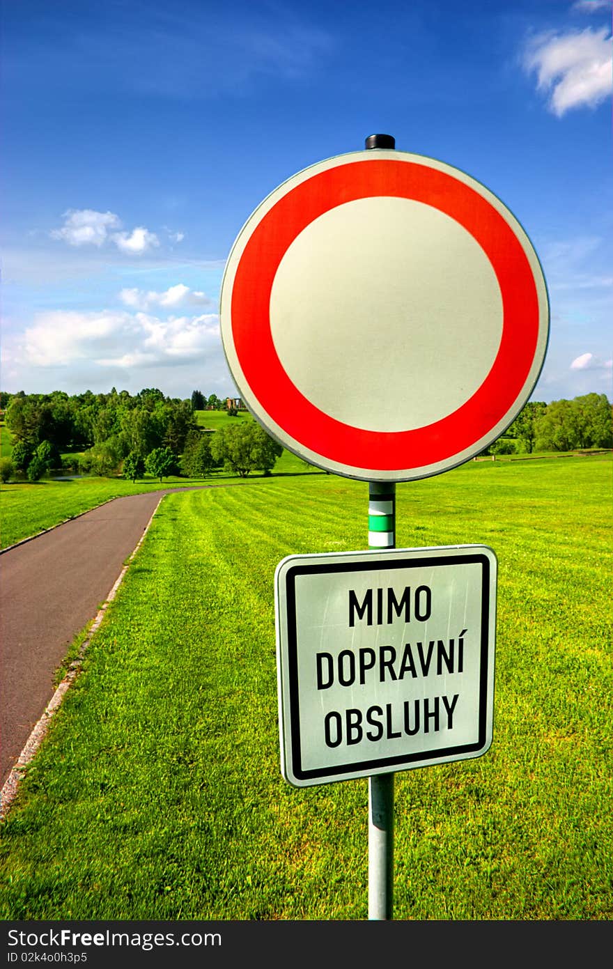 HDR closeup photography of usual european (czech) do not enter sign at the border of park.