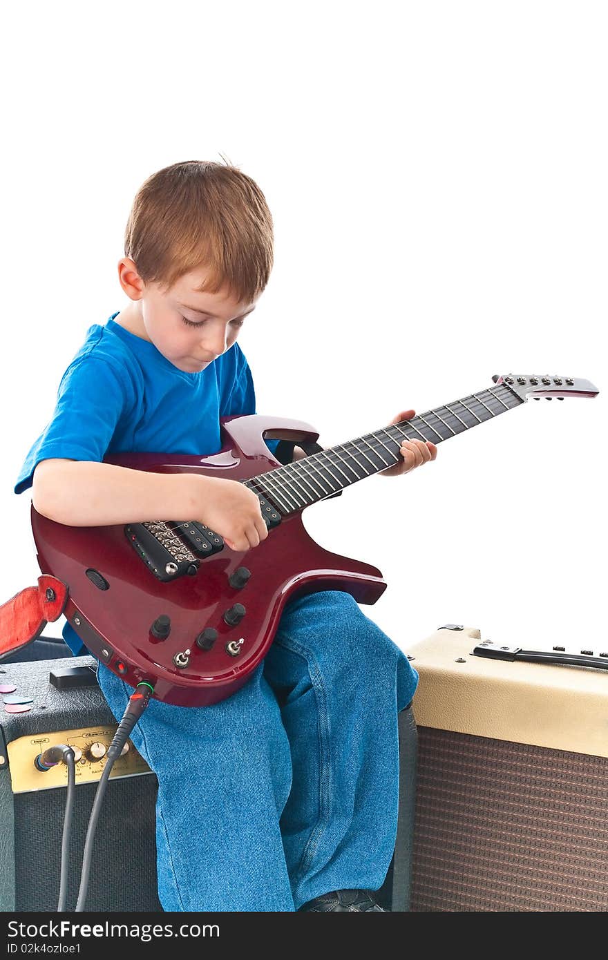 Five year old rockstar playing his guitar