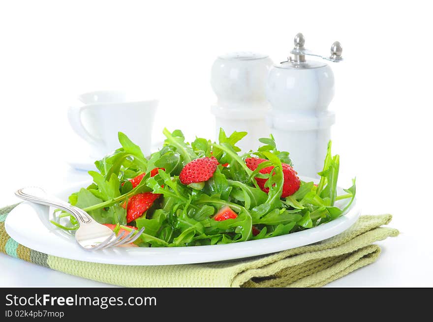 Fresh salad of arugula and strawberries with vinaigrette. Fresh salad of arugula and strawberries with vinaigrette.