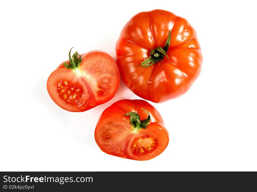 Fresh tomato close-up on white background with cut