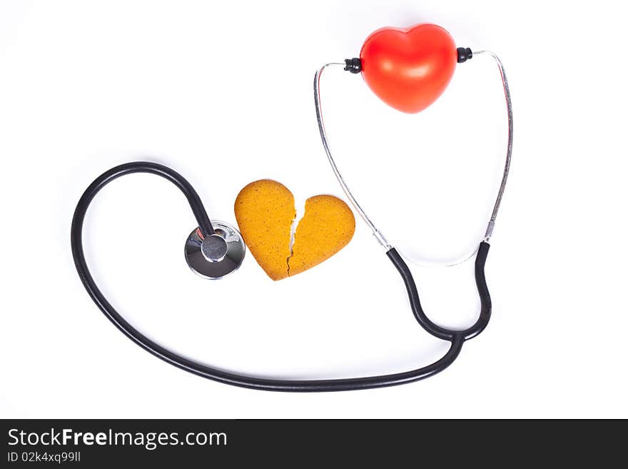 Healing a broken heart with  a sthethoscope on white background