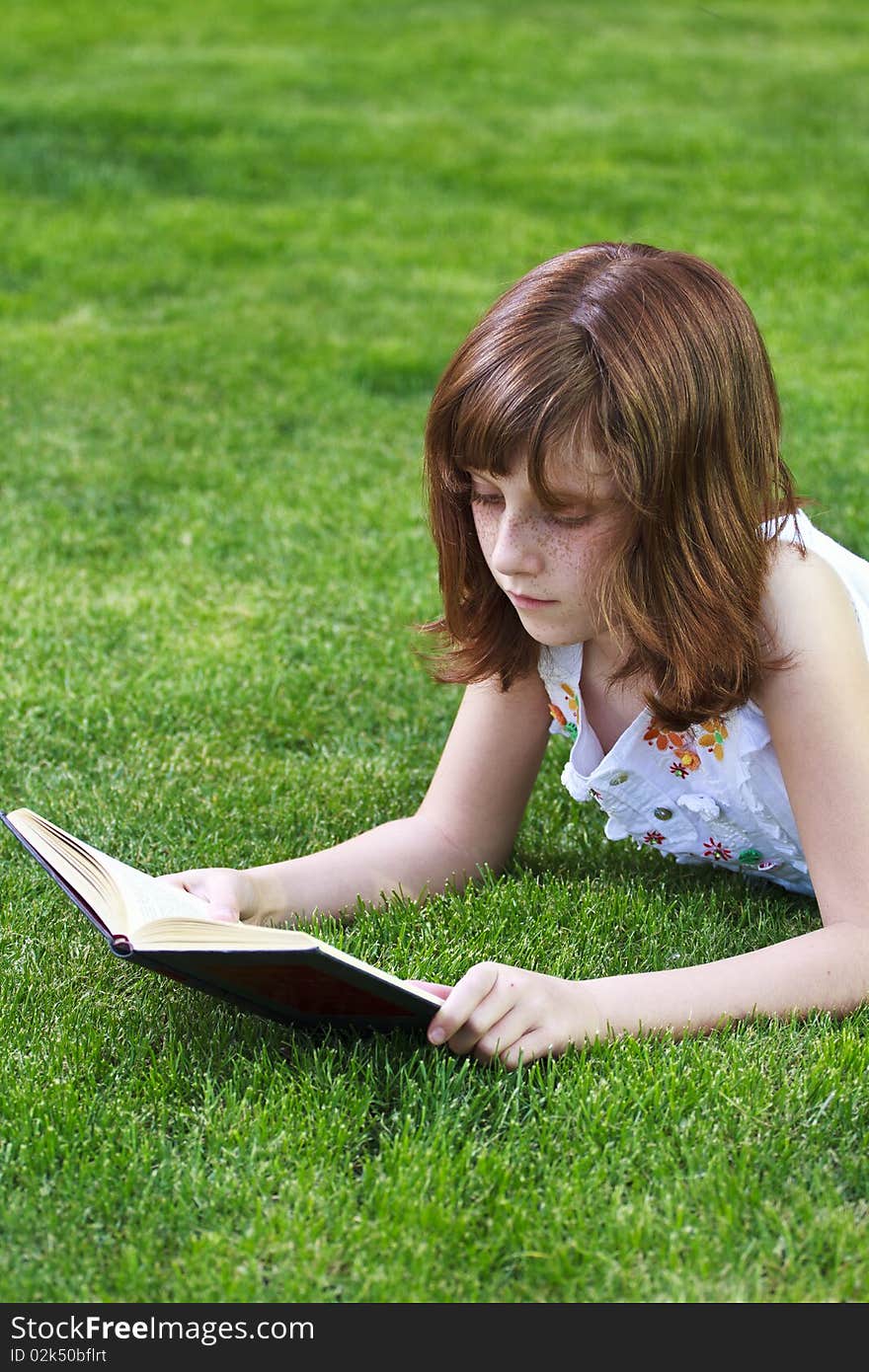 Young Beautiful Girl Reading