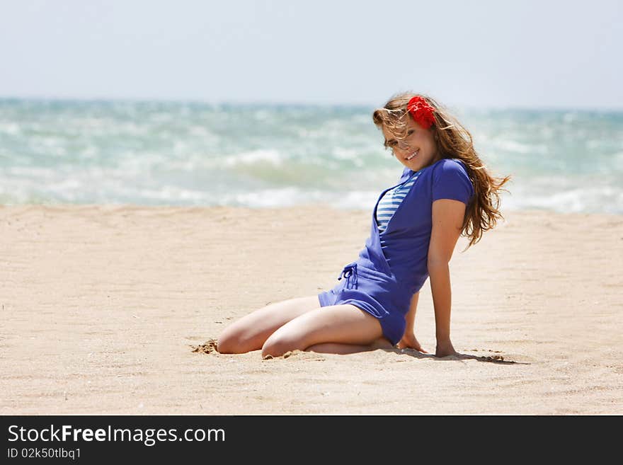 Young beautiful woman on beach