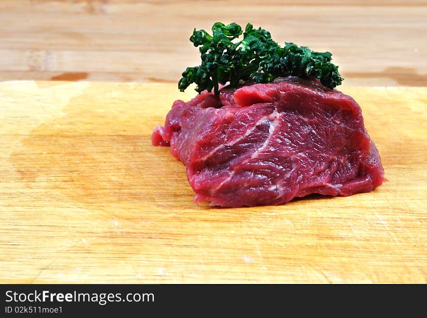 Raw beef meat on cutting board for barbecue