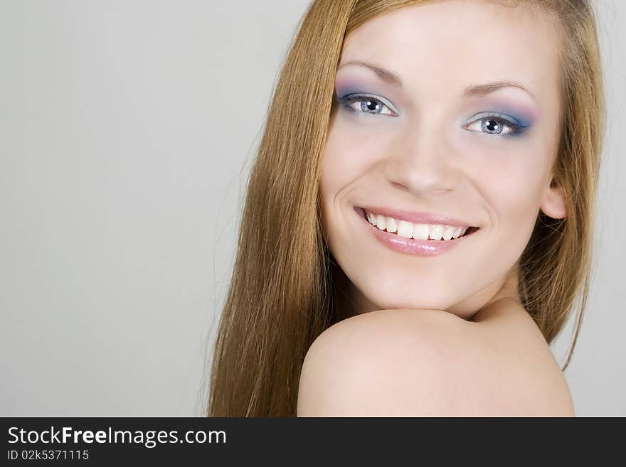 Beautiful smiling young woman face. Beautiful smiling young woman face.