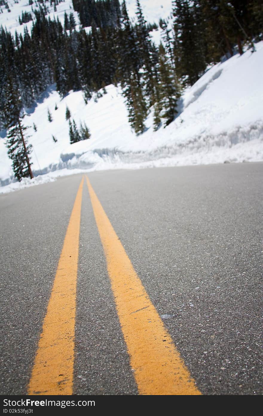 Artistic photograph of road leading up a snow covered mountain. Artistic photograph of road leading up a snow covered mountain.