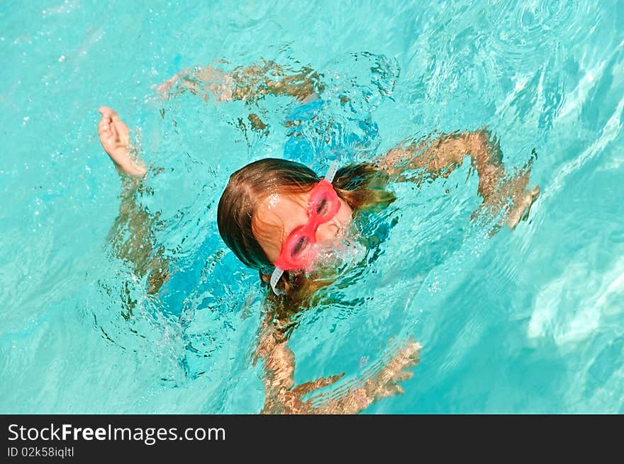 Young Girl Playing In A Pool