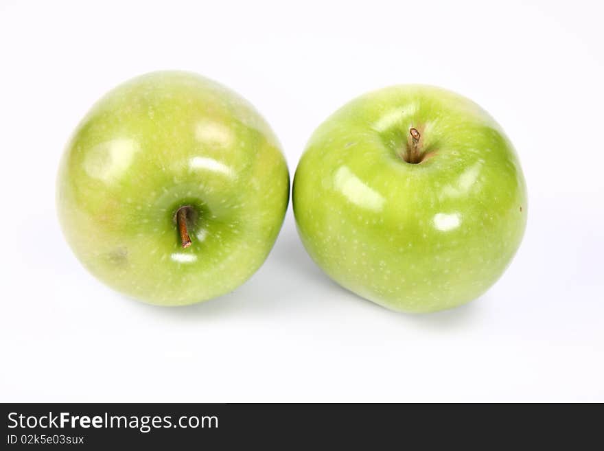 Two green apples on white background