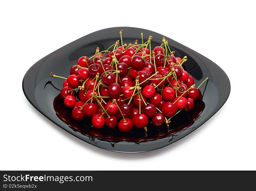 Fresh ripe cherry berry in black glass dish