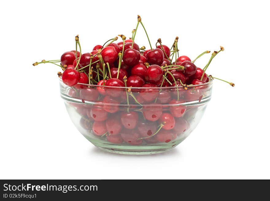 Fresh ripe cherry berry in glass dish on white background