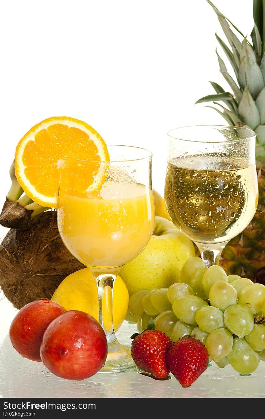 Various juice in glass surrounded by fresh fruit. Various juice in glass surrounded by fresh fruit