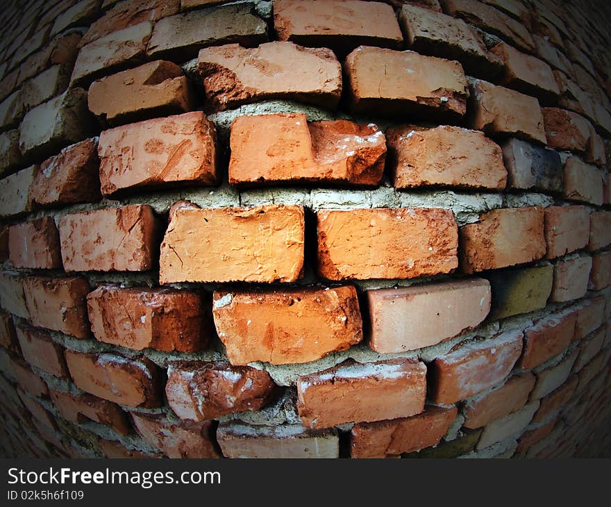 Fish eye wide angle distorted photo of an old brick wall. Fish eye wide angle distorted photo of an old brick wall