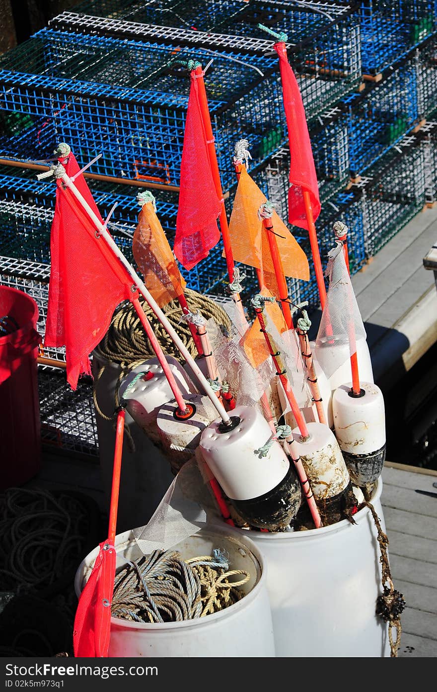 Dock barrels full of floats and lobster equipment. Dock barrels full of floats and lobster equipment