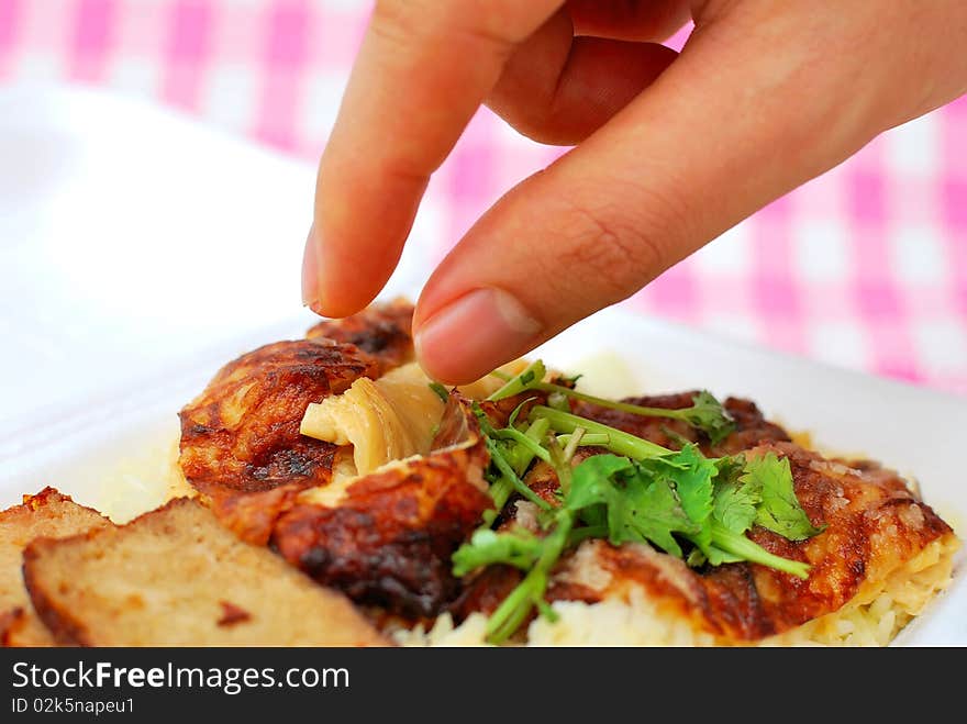 Finger Reaching For Roasted Chicken