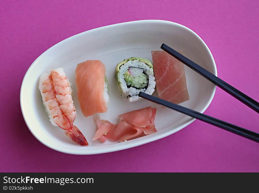 Sushi rolls on oval plate. Sushi rolls on oval plate