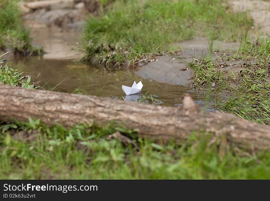 A Toy Boat in a Stream