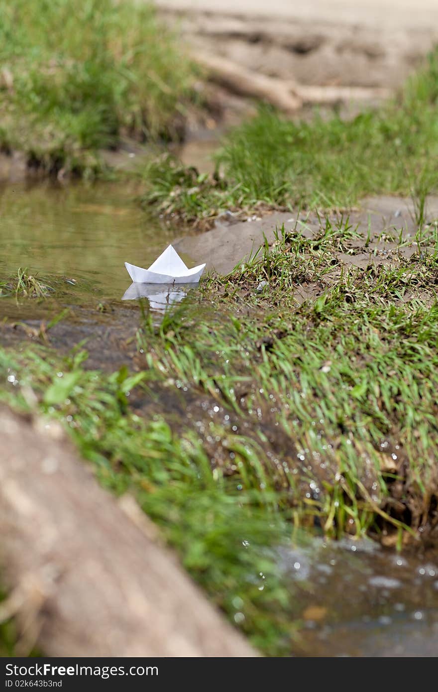 A Toy Boat in a Stream