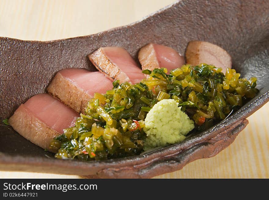 A fried fish with fruit