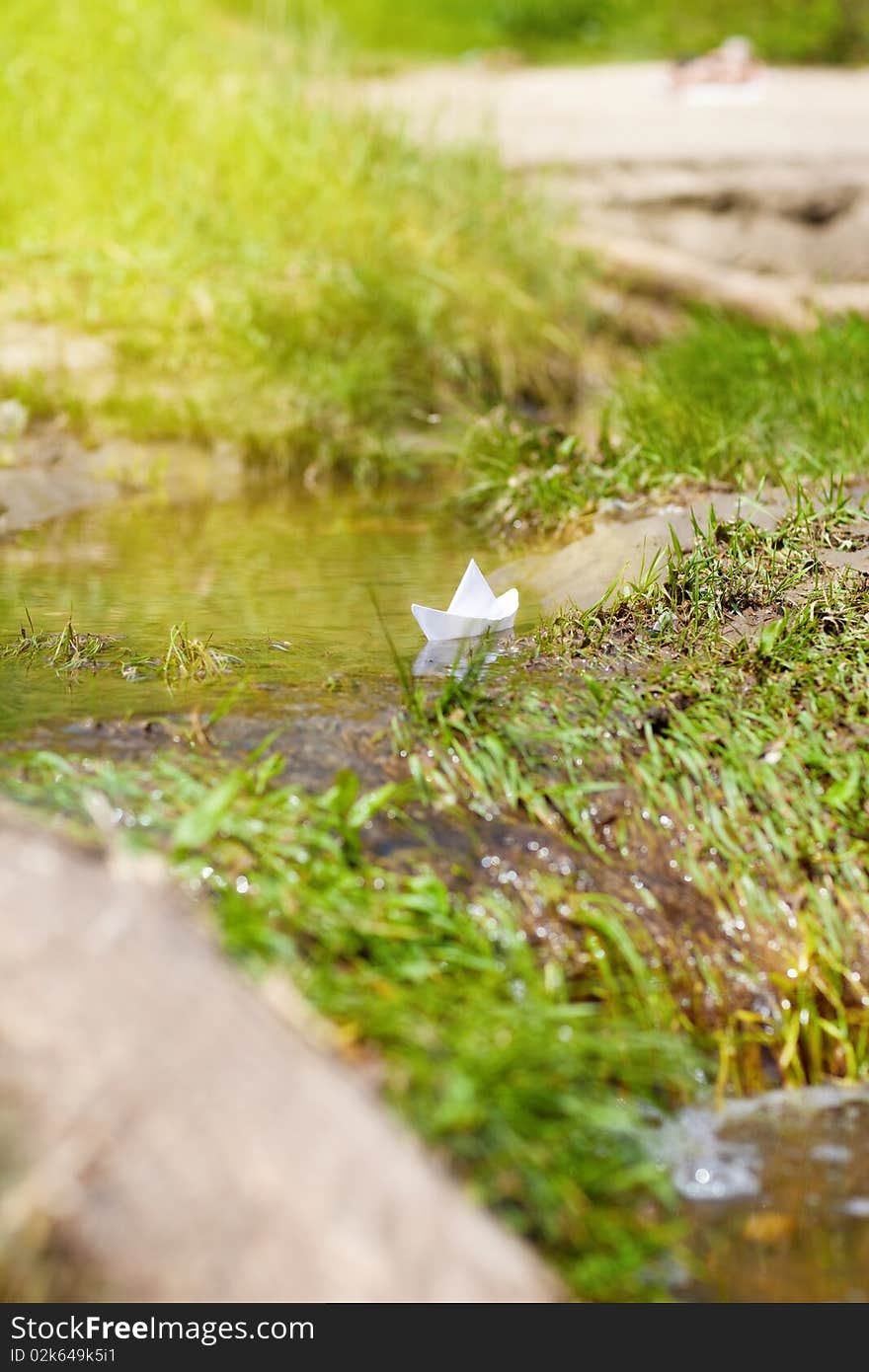 A Toy Boat in a Stream