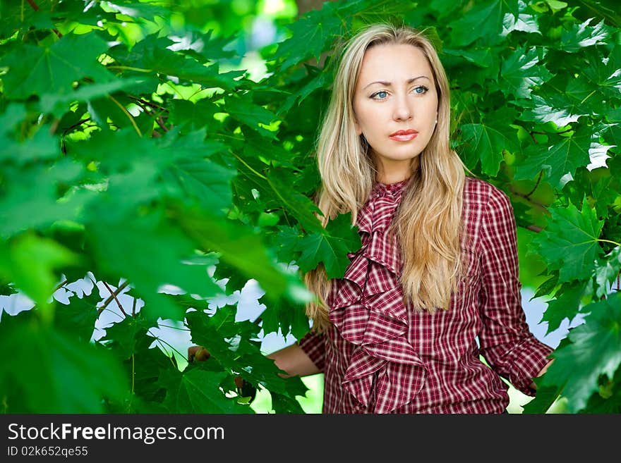 Beautiful blond girl relaxing outdoors