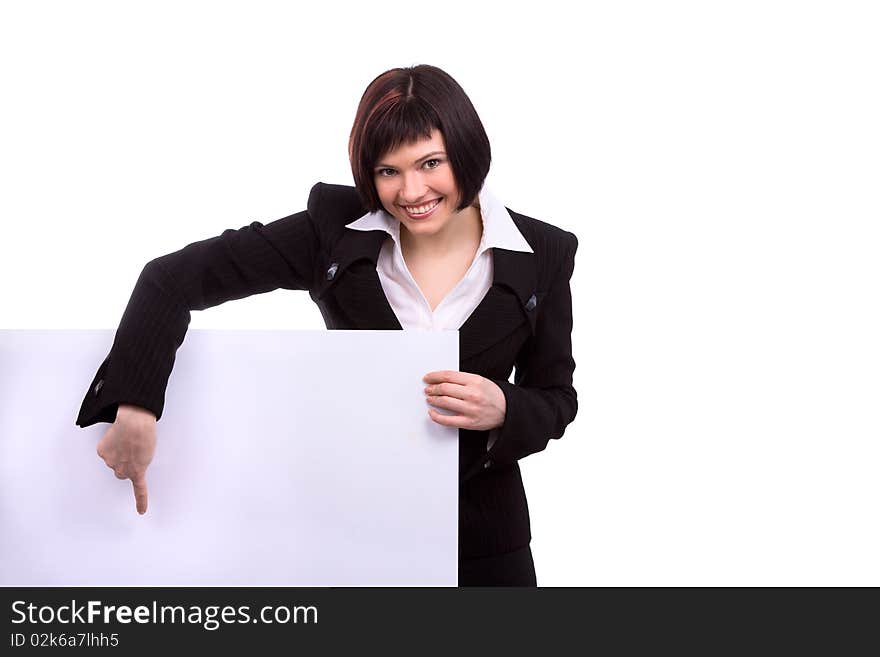 Portrait of a happy businesswoman pointing at white blank card against isolated white background. Business woman standing beside a billboard. Portrait of a happy businesswoman pointing at white blank card against isolated white background. Business woman standing beside a billboard.