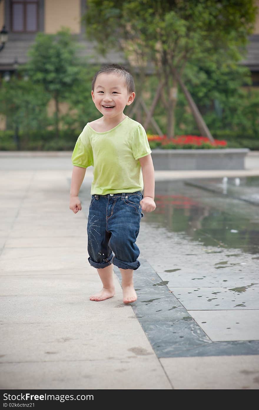 Laughing chinese boy in green