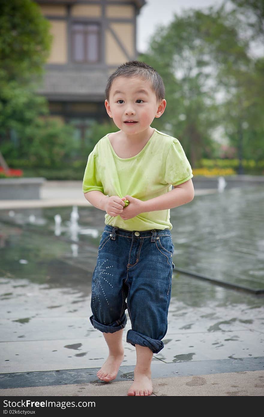 Cute chinese boy in green