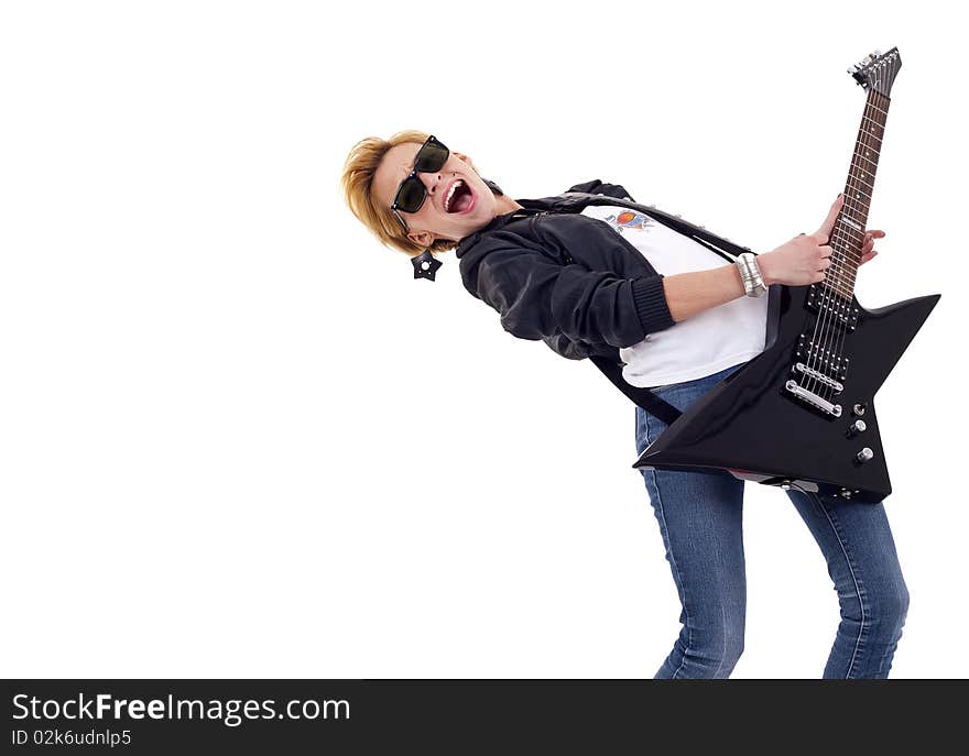 Beautiful young and attractive woman playing an electric guitar - with lots of copyspace. Beautiful young and attractive woman playing an electric guitar - with lots of copyspace